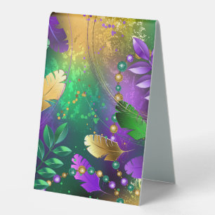 Iridescent mardi gras background with beads
