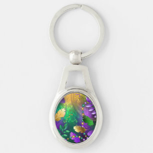 Iridescent mardi gras background with beads key ring