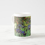 Irises by Van Gogh Fine Art China Mug<br><div class="desc">Irises was painted in 1889 while Vincent van Gogh was living at the asylum at Saint Paul-de-Mausole in Saint-Rémy-de-Provence, France, in the last year before his death in 1890. A stunning display of violet irises with vibrant green leaves, rich terracotta soil, against a back drop of bright orange marigolds and...</div>