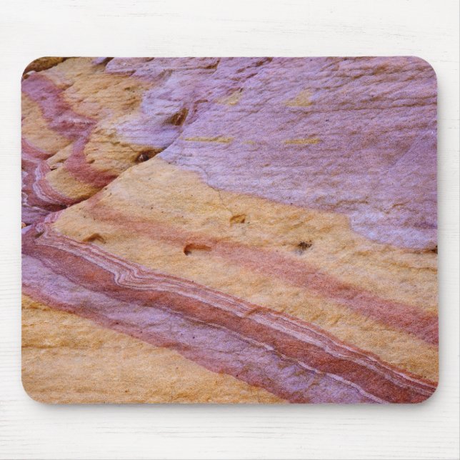 Iron oxides color a sandstone formation mouse pad (Front)