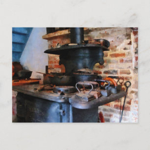Irons Heating on Stove Postcard