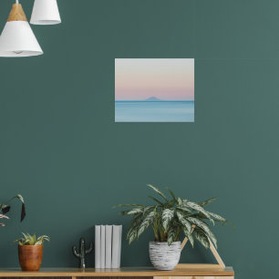 Island silhouette on horizon at sunset poster