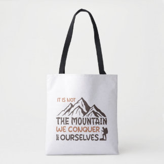 it is not the mountain we conquer but ourselves tote bag