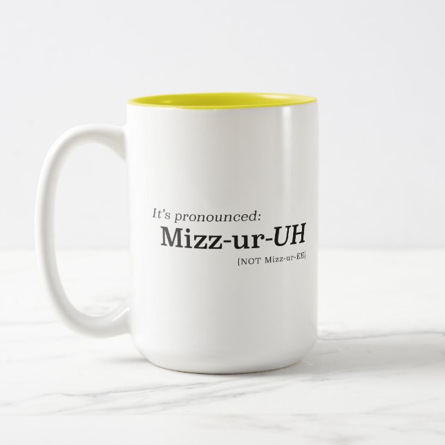 It’s Pronounced Mizz-ur-UH {NOT Mizz-ur-EE} Two-Tone Coffee Mug (Left)