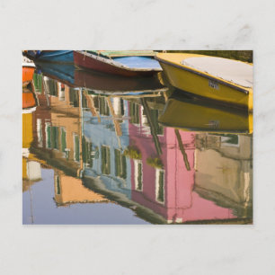 Italy, Burano. Boats on a canal with Postcard