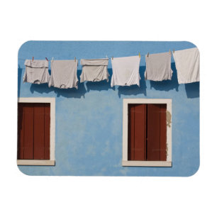 Italy, Burano. Hanging laundry and windows along Magnet