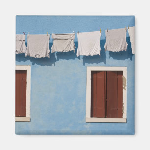 Italy, Burano. Hanging laundry and windows along Magnet