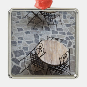 Italy, Sardinia, Castelsardo. Cafe tables. Metal Ornament