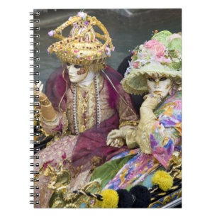 Italy, Venice. Couple dressed in costumes for Notebook