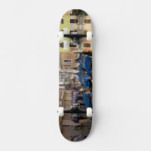 Italy, Venice, gondolas moored along canal Skateboard