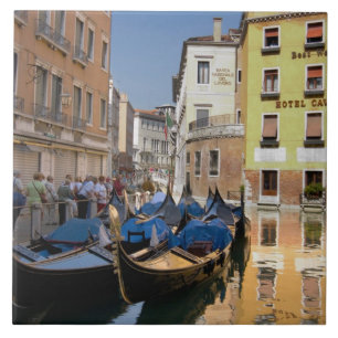 Italy, Venice, gondolas moored along canal Tile