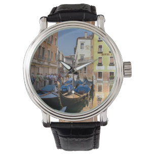 Italy, Venice, gondolas moored along canal Watch