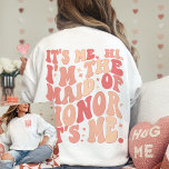 Its Me Hi Im the Maid Of Honour Its Me Personalise Sweatshirt<br><div class="desc">Introducing the "It's Me Hi I'm the Maid of Honour" Personalised Sweatshirt – a trendy and cute peach coral pink garment that adds a touch of fun and style to your Maid of Honour's wardrobe. This cool bachelorette party shirt features a front and back print with retro wavy text, making...</div>