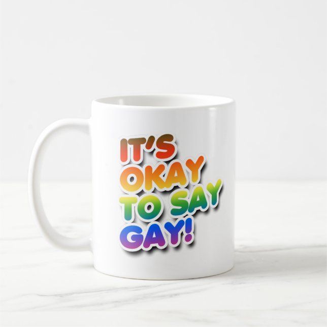 It's okay to say gay coffee mug (Left)