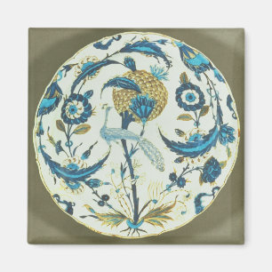 Iznik dish painted with a peacock perched among fl magnet