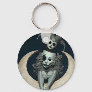 Jester sits on crescent moon wireless charger  key ring