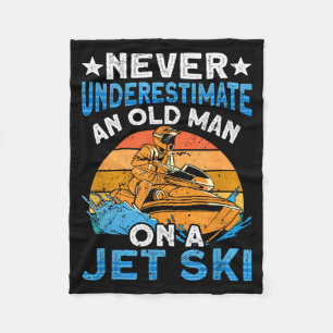 Jet skiing underestimate an old man on a jet ski fleece blanket