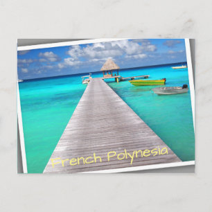 Jetty with boats in a tropical lagoon postcard