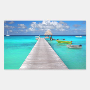 Jetty with boats in a tropical lagoon rectangular sticker