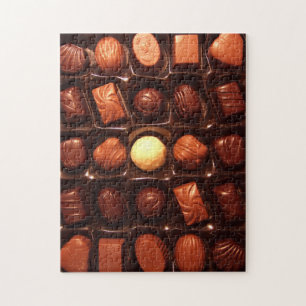Jigsaw puzzle featuring box of chocolate candy