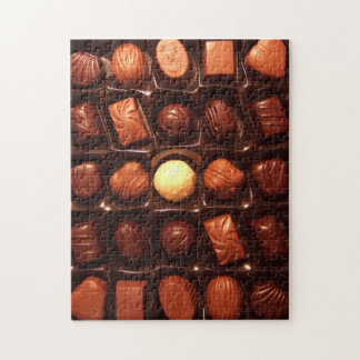 Jigsaw puzzle featuring box of chocolate candy