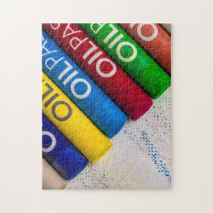 Jigsaw puzzle of different coloured pastel crayons