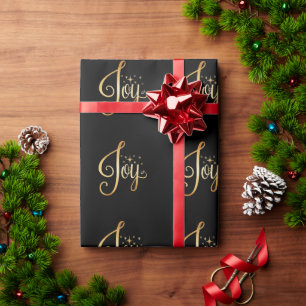 “Joy” Black Gold Script Elegant Holiday Wrapping Paper