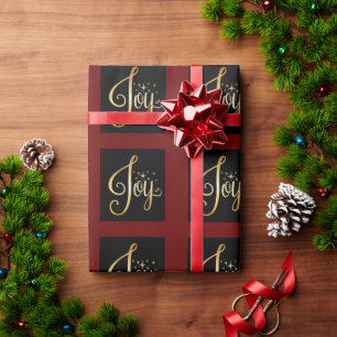 “Joy” Black Red Gold Script Elegant Holiday Wrapping Paper