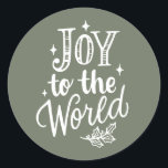 Joy to the World Lettering Taupe Green Christmas Classic Round Sticker<br><div class="desc">Celebrate the season with this rustic Christmas sticker featuring “Joy to the World” in chalkboard-style hand lettering. The festive message stands out against a classic background, available in multiple color options. Use this taupe green Christmas sticker to seal holiday envelopes, decorate gift packaging, or add a cheerful touch to treat...</div>