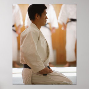 Judo Master Kneeling On a Mat Poster