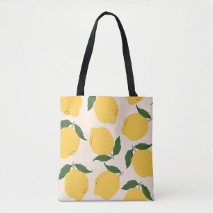 Juicy yellow Lemons, green leaves. Fresh tasty fru Tote Bag