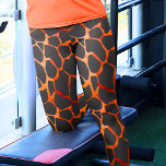 Jungle Giraffe Print Leggings<br><div class="desc">These leggings are beautifully designed with a mesmerising orange and black giraffe spots pattern, offering a unique and stylish addition to your wardrobe. The pattern showcases the distinctive and elegant spots that are characteristic of giraffes, creating a sophisticated and eye-catching look. The leggings are made from high-quality and stretchy fabric,...</div>