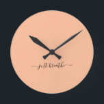 Just breathe orange elegant script yoga  round clock<br><div class="desc">Modern yoga clock with a chic orange (peach fuzz) background and an elegant hand lettered black script with the quote "just breathe".</div>