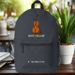 Just Cellin Cellist Musician Gag Novelty Printed Backpack<br><div class="desc">Embrace your passion for music with our unique "Just Cellin" backpack, designed specifically for the discerning cello player. This stylish and functional backpack features a vibrant illustration of a cello, elegantly complemented by the witty phrase "Just Cellin" – a perfect conversation starter for fellow musicians. Spacious enough to carry your...</div>