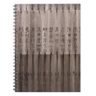 Kanji text on board notebook