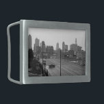 Kansas City Urban Skyline, Black and White Photo Belt Buckle<br><div class="desc">In Kansas City, Missouri, six lane Main Street stretches out from the bottom right corner of the black and white photograph towards the misty skyscraper horizon in the distance. A dark sedan, below and left of centre, drives perpendicular to the lanes of traffic creating a moment of intrigue in the...</div>