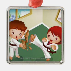 Karate boy holding wood with another breaking it metal ornament