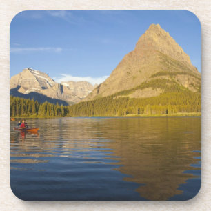 Kayaking in Swiftcurrent Lake at sunrise in the Coaster