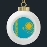 Kazakhstan Flag Ceramic Ball Christmas Ornament<br><div class="desc">The Kazakhstan flag is a blue field with in the centre a sun and an eagle and on the a national ornamental pattern. The used colours in the flag are blue, yellow. The proportion of the Kazakhstan flag is 1:2. The Flag of Kazakhstan was adopted in 1992. The first use...</div>