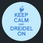 KEEP CALM AND DREIDEL ON CLASSIC ROUND STICKER<br><div class="desc">Happy Holigays! Shop Holiday Humour, LGBTQ Designs and Funny Christmas Gifts From LGBTShirts.com Shop for Everyone and Browse over 10, 000 LGBTQ Gifts, Holiday Humour, Equality, Slang, & Culture Designs. The Most Unique Gay, Lesbian Bi, Trans, Queer, and Intersexed Apparel on the web. SHOP MORE LGBTQ Designs and Gifts at:...</div>