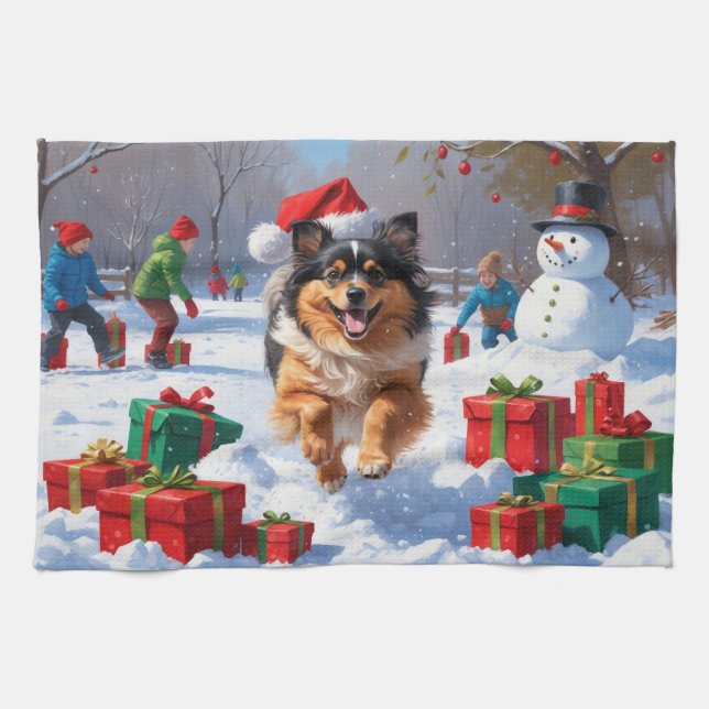 Keeshond Dog Running in Snow with Christmas Hat Tea Towel (Horizontal)