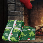 Kids Christmas Dinosaur Cute Custom Green  Wrapping Paper<br><div class="desc">Awesome green dinosaur Christmas wrapping paper. This apatosaurus looks very cute in a holiday red Santa hat with a little smile. I like prehistoric Christmas animals and presents that kids will love. Customise this gift with the recipient's name to make it even more personalised.</div>