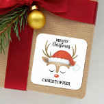 Kids Cute Christmas Reindeer Square Sticker<br><div class="desc">A cute and whimsical reindeer face with a Santa hat decorates this square sticker with the words Merry Christmas. Fun for your holiday gifts. Personalise it with your name. Designed for you by Blackberry Boulevard.</div>