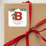 Kids Elf Initial B Christmas Square Sticker<br><div class="desc">Give the gift of personalised charm this Christmas! Our monogram stickers,  featuring Santa's elf hiding behind the letter B,  are a unique and thoughtful way to show your love. Customise with a name,  year and a heartfelt greeting. Make your Christmas gifts stand out!</div>