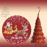 Kid's Santa Christmas Reindeer Red Party Crafts  Classic Round Sticker<br><div class="desc">Red fun round sticker featuring Santa Claus, reindeer and snowflakes for fun Christmas party. Fun Merry Christmas sticker for party labels and crafts. Make the Christmas party fun and frolic with distribution of sticker gifts to kids. Customise text is available to fit in your Font Style. Visit my store for...</div>