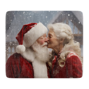 Kissing Mr and Mrs Santa Claus Cutting Board