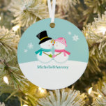 Kissing Snowmen Christmas Metal Tree Decoration<br><div class="desc">Custom Christmas ornament featuring an adorable and unique vector illustration  of a couple of snowmen kissing in the snow on a winter blue background. Personalise it with your names,  wedding anniversary date,  or any text of your choice to make the perfect First Christmas  or couple ornament keepsake.
  ©Sanqunetti Design</div>