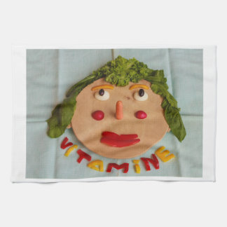 kitchen towel with a cutting-board with vegetables