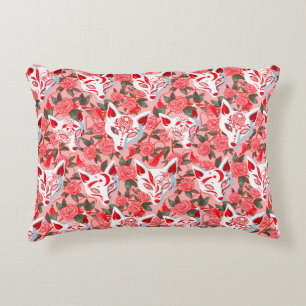 Kitsune masks and blooming camellia on pink decorative cushion