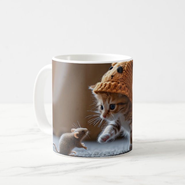 Kitten playing with a small mouse coffee mug (Front Left)